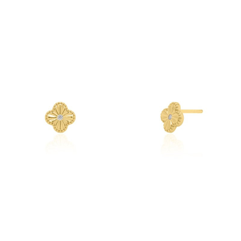 Gold earrings with a clover design on a white background