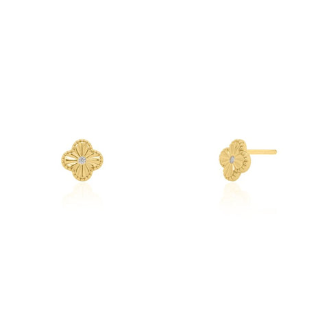 Gold earrings with a clover design on a white background