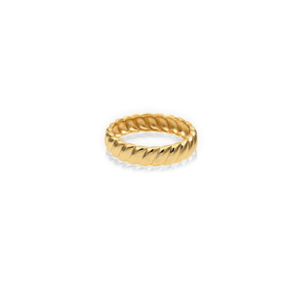 Gold ring with a textured design on a white background