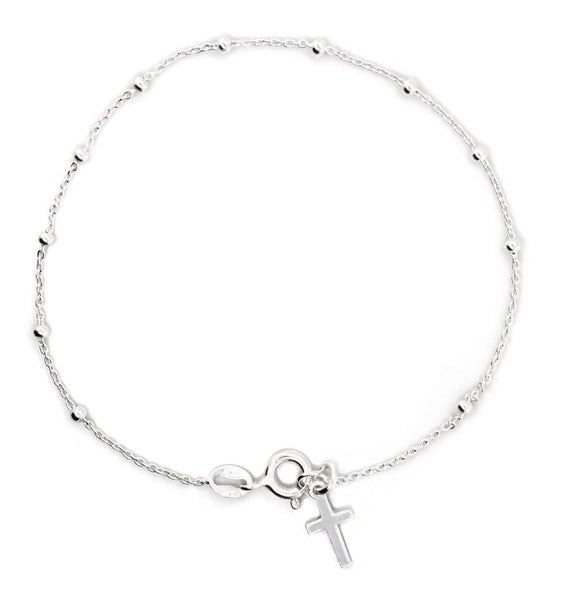 Silver bracelet with a cross charm on a white background