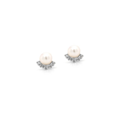 Pair of pearl earrings with silver accents on a white background