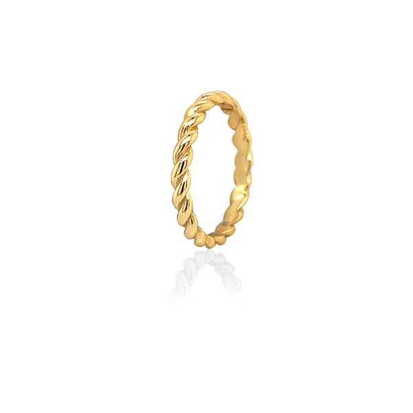 Gold ring with a twisted design on a white background