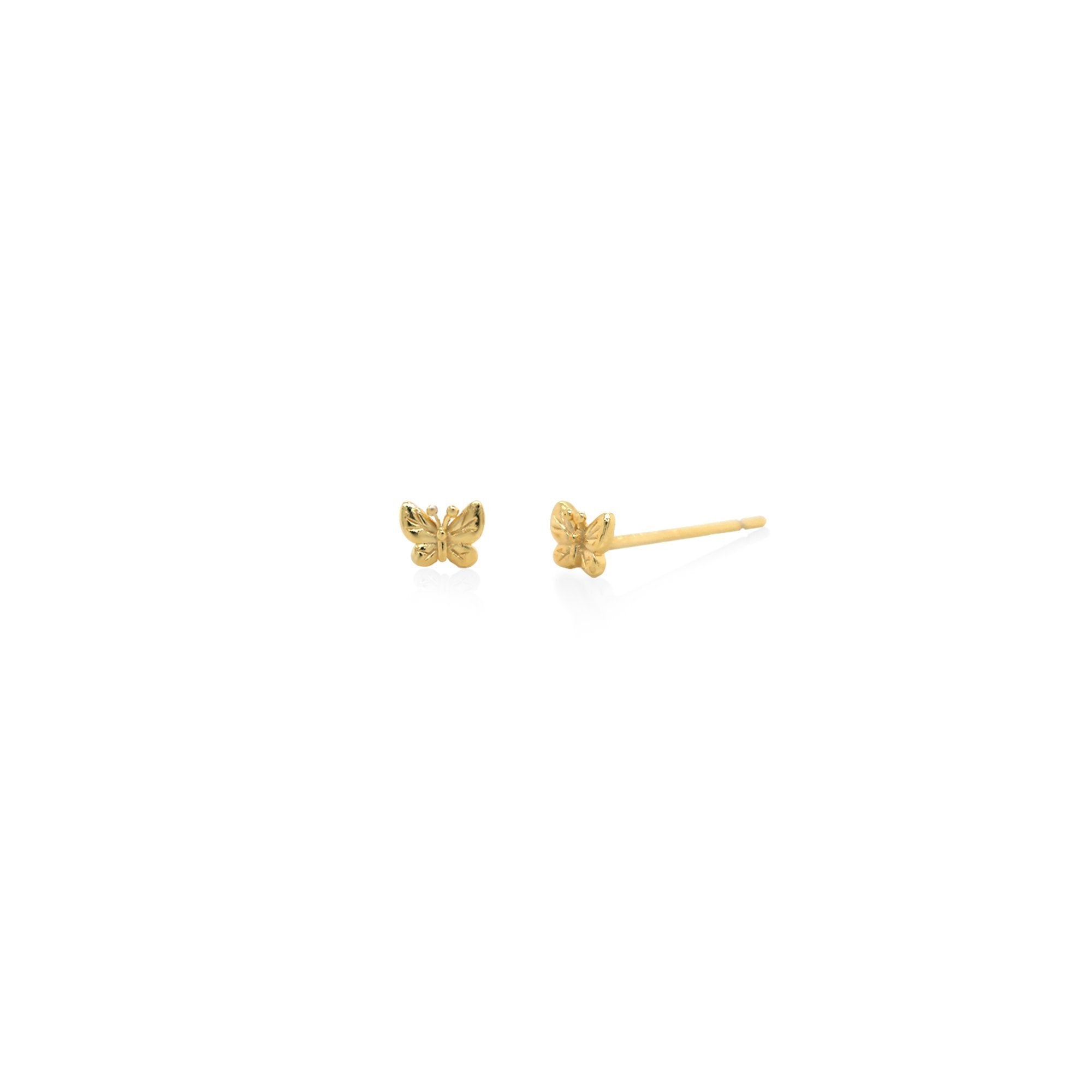 Gold butterfly earrings on a white background