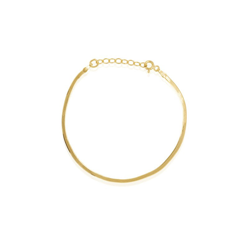 Gold bracelet on a white background