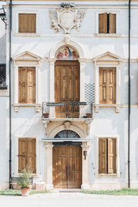 Matching brown doors and shutters in Italy