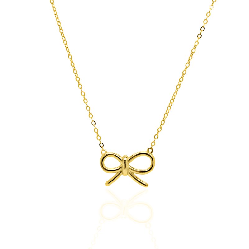 Gold bow-shaped pendant on a chain against a white background