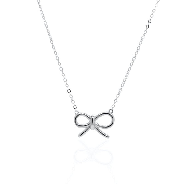 Silver bow-shaped pendant on a chain against a white background