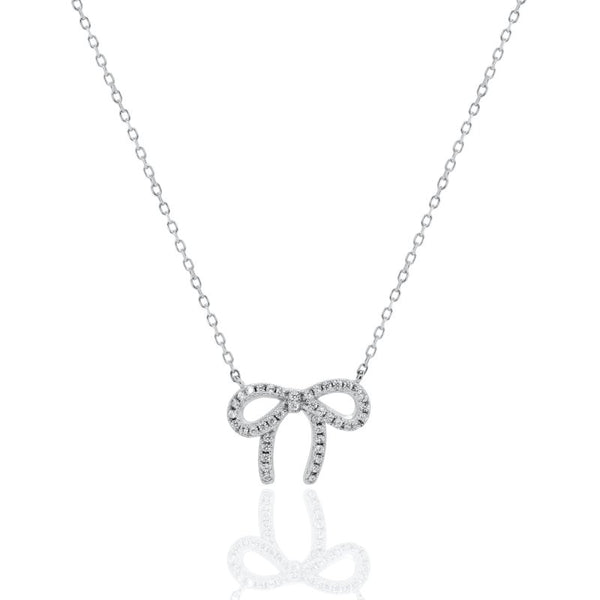 Silver bow-shaped pendant necklace on a white background