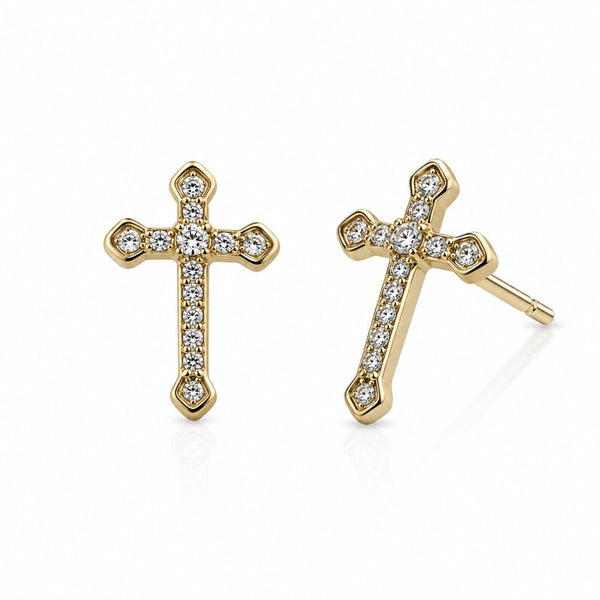A pair of gold cross stud earrings set with clear pavé gemstones, shown from both front and side angles on a clean white background.