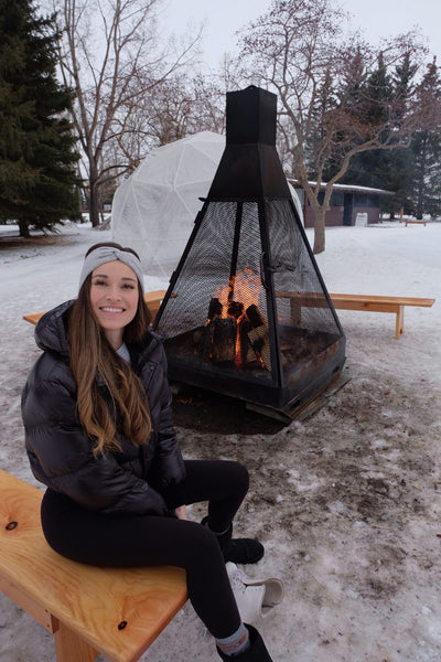 @lachelseayoung wearing Sisterberry & Co's Winterberry Cashmere Headband in Grey while sitting by the campfire